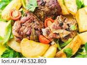 Danish meat baked with new potatoes.Roasted meat. Grilled meat and potatoes. Стоковое фото, агентство Ingram Publishing / Фотобанк Лори