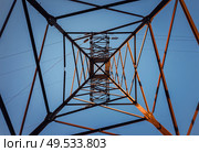 Underneath a truss pillar construction. Different geometric shapes, patterns of a steel structure. Metallic texture of an electricity pole. Стоковое фото, агентство Ingram Publishing / Фотобанк Лори