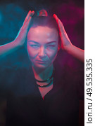 Color light on a female portrait. Neon light. Стоковое фото, агентство Ingram Publishing / Фотобанк Лори