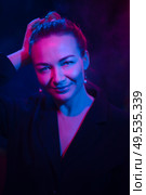 Color light on a female portrait. Neon light. Стоковое фото, агентство Ingram Publishing / Фотобанк Лори