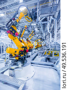 robotic arms in a car plant. robots in a car plant. Стоковое фото, агентство Ingram Publishing / Фотобанк Лори