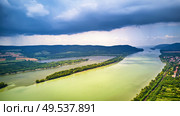 Aerial view of Danube river near Visegrad in Hungary. Rain and stormy weather on Danube river valley panorama. . Стоковое фото, агентство Ingram Publishing / Фотобанк Лори