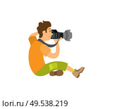 Photographer taking photo with modern digital camera sitting on floor. Videographer recording video, powerful zoom device vector paparazzi or reporter. Photographer Taking Photo on Modern Digital Camera. Стоковая иллюстрация, агентство Ingram Publishing / Фотобанк Лори