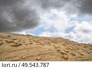 Bricks in the sand left remains of a building in the desert under a blue sky. Стоковое фото, агентство Ingram Publishing / Фотобанк Лори