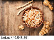 Salad of Jerusalem artichoke and horseradish roots, vegetarian side dish.. Jerusalem artichoke salad. Стоковое фото, агентство Ingram Publishing / Фотобанк Лори