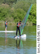a couple of windsurfer on the lake. Стоковое фото, агентство Ingram Publishing / Фотобанк Лори