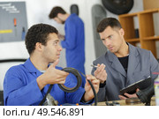 portrait of apprentice learning skills. Стоковое фото, агентство Ingram Publishing / Фотобанк Лори