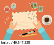 Hands holding envelope with stamps. Stationery. Top view. Sending written letter through postal service. Vector flat illustration. Стоковая иллюстрация, агентство Ingram Publishing / Фотобанк Лори