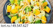 Vitamin spring salad with mango, cucumber, sprouts and mustard.Sprout salad,closeup. Salad with mango and vegetables. Стоковое фото, агентство Ingram Publishing / Фотобанк Лори