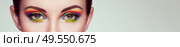 Female eye with  rainbow make-up.  Long eyelashes, vivid colorful eyeshadows. Beauty. Close up, Macro. Стоковое фото, агентство Ingram Publishing / Фотобанк Лори