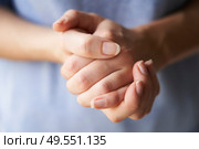 Close Up of a Woman rubbing her hands together with disinfectant . Стоковое фото, агентство Ingram Publishing / Фотобанк Лори