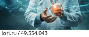 A doctor is seen holding a ball in his hands, showcasing an interactive therapeutic method in a medical setting. Стоковое AI-изображение, AI-художник Данила Большаков / Фотобанк Лори