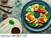 Salad with stewed mushrooms, cucumber,tomato and nasturtium.. Mushroom salad with vegetables. Стоковое фото, агентство Ingram Publishing / Фотобанк Лори