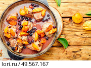 Baked pork in red wine with apricot and blackcurrant.. Stew meat with apricot. Стоковое фото, агентство Ingram Publishing / Фотобанк Лори