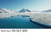 Arctic landscape with open water and snow mountains. Global warming concept with melting ice and blue water. Footage. Стоковое AI-видео, аниматор Анжелика Самсонова / Фотобанк Лори