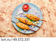 Juicy lula kebab made from meat.Minced meat on the grill. Lula kebab on stick. Стоковое фото, агентство Ingram Publishing / Фотобанк Лори
