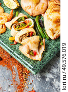 Grilled squid stuffed with vegetables.Delicious stuffed cuttlefish. Baked squid stuffed. Стоковое фото, агентство Ingram Publishing / Фотобанк Лори