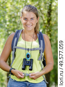 portrait of a young woman with binoculars. Стоковое фото, агентство Ingram Publishing / Фотобанк Лори