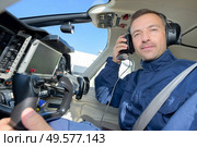 a pilot in a helicopter. Стоковое фото, агентство Ingram Publishing / Фотобанк Лори
