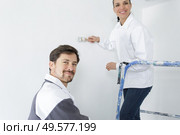 happy professional painters working indoors. Стоковое фото, агентство Ingram Publishing / Фотобанк Лори