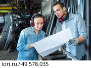 two worker in factory on the machine. Стоковое фото, агентство Ingram Publishing / Фотобанк Лори