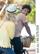 couple enjoying a spring day biking in nature. Стоковое фото, агентство Ingram Publishing / Фотобанк Лори