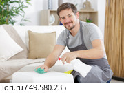 happy man is holding spray. Стоковое фото, агентство Ingram Publishing / Фотобанк Лори