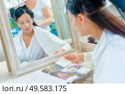 a woman is having her hair done in hair salon. Стоковое фото, агентство Ingram Publishing / Фотобанк Лори