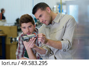 a portrait of people examining medical parts. Стоковое фото, агентство Ingram Publishing / Фотобанк Лори