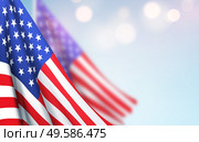 America flag waving against a clear blue sky. Design Concept for National American Holidays. Patriot Day, Independence Day, Veteran Day. Vector illustration EPS10. America flag waving against a clear blue sky. Design Concept for National American Holidays. Patriot Day, Independence Day, Veteran Day. Vector illustration. Стоковая иллюстрация, агентство Ingram Publishing / Фотобанк Лори