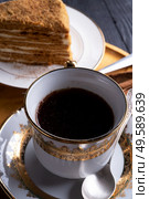 coffee with dessert served at wooden tray at black wooden table. . Стоковое фото, агентство Ingram Publishing / Фотобанк Лори
