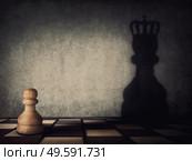 Surreal transformation of the pawn chess piece into a powerful king or queen. Motivation and self confidence metaphor, overcoming obstacles and achieving success. Leadership and authority concept. Стоковое фото, агентство Ingram Publishing / Фотобанк Лори