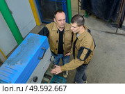 factory workers outside discussing issues. Стоковое фото, агентство Ingram Publishing / Фотобанк Лори