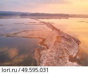 Sunrise spring melting river flood aerial panorama. Overflow water at springtime. Rural April landscape. Meadows covered by water. Morning flood-land near Neman, Belarus. . Стоковое фото, агентство Ingram Publishing / Фотобанк Лори