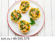 Plate with cheese basket with avocado,cowpea and nuts.Banquet,holiday food. Cheese basket stuffed with vegetables. Стоковое фото, агентство Ingram Publishing / Фотобанк Лори
