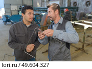 Men in industrial factory. Стоковое фото, агентство Ingram Publishing / Фотобанк Лори