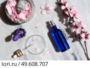 Retinol and almond oil serum beauty care in blue bottles, anti aging natural cosmetic, laboratory testing concept. Retinol and almond oil serum oil beauty care. Стоковое фото, агентство Ingram Publishing / Фотобанк Лори