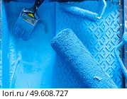 House renovation tools in blue paint close up. House renovation tools. Стоковое фото, агентство Ingram Publishing / Фотобанк Лори