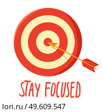 Poster with target, arrow in the center and lettering Stay focused. Motivational banner for self-control. Inspirational slogan phrase for poster under the dartboard with red and white circles. Poster with target, arrow and lettering Stay focused. Motivational banner for self-control. Стоковая иллюстрация, агентство Ingram Publishing / Фотобанк Лори