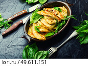 Pie stuffed with spring greens and cheese. Homemade qutabs or kutab. Azeyrbajan food. Tasty Azerbaijani qutab with young greens. Стоковое фото, агентство Ingram Publishing / Фотобанк Лори