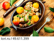 Chicken leg stuffed with mushroom and cherry plum. Baked meat dish with fruit. Chicken drumstick stuffed with plum. Стоковое фото, агентство Ingram Publishing / Фотобанк Лори