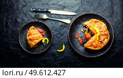 Mexican pie with smoked sausage and chicken.Meat pie.Flat lay. Mexican meat pie. Стоковое фото, агентство Ingram Publishing / Фотобанк Лори