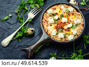Shakshuka, Israeli cuisine,mix of tomato sauce, fried with hot peppers, spices, minced meat and eggs.Scrambled eggs. Israeli shakshuka, arabic cuisine. Стоковое фото, агентство Ingram Publishing / Фотобанк Лори