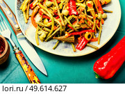 Spicy salad of stewed vegetablesSpicy appetizer of peppers,asparagus beans,olives and tomato. Hot vegetable salad. Стоковое фото, агентство Ingram Publishing / Фотобанк Лори