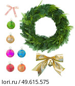 christmas set with green wreath, golden bow and multicolored balls  isolated on white background. Стоковое фото, агентство Ingram Publishing / Фотобанк Лори