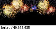 Fireworks colorful explosions on black, festive extra wide web banner background with copy space. Fireworks explosions on black. Стоковое фото, агентство Ingram Publishing / Фотобанк Лори