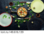 Shakshuka, Israeli cuisine,mix of tomato sauce, fried with hot peppers, spices, minced meat and eggs.Scrambled eggs. Israeli shakshuka, arabic cuisine. Стоковое фото, агентство Ingram Publishing / Фотобанк Лори