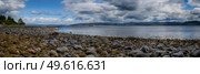 Panoramic view of rocks and boulders on the shore of the Firth of Clyde on the West coast of Scotland. Стоковое фото, агентство Ingram Publishing / Фотобанк Лори