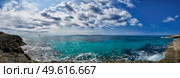 Panoramic view of lighthouse in Mediterranean sea off the coast of Menorca at Punta Prima. Стоковое фото, агентство Ingram Publishing / Фотобанк Лори