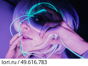 Weird dystopian theme portrait with blue neon lights. Стоковое фото, агентство Ingram Publishing / Фотобанк Лори